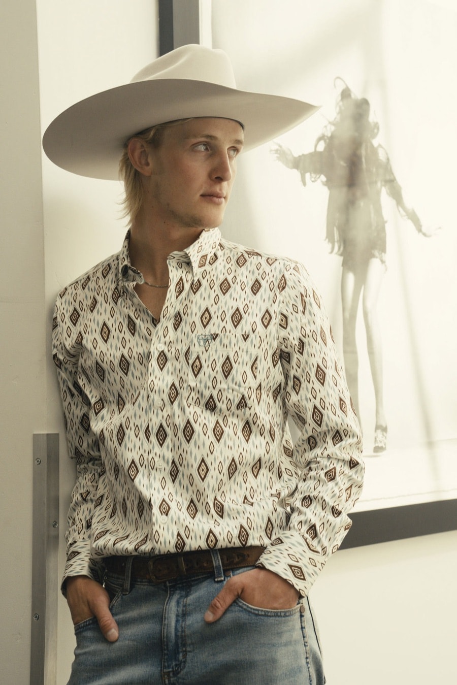 Diamond print shirt, tooled belt and felt hat